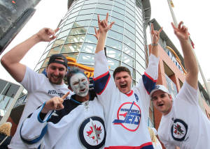 Winnipeg Jets fans on their way to the MTS Centre before the Winnipeg Jets game against the Montreal Canadiens. The game is Winnipeg's first NHL regular season game in 15 years. Winnipeg lost 5-1.